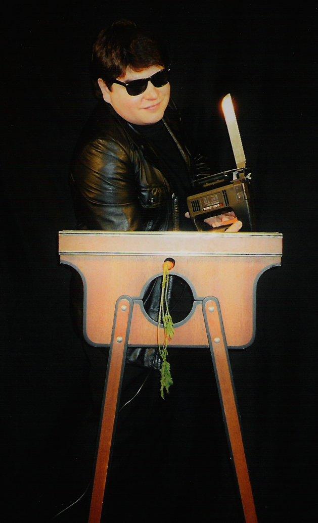 Magician Olivier OK MAGICS with electric saw illusion