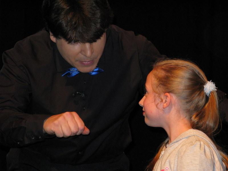 Magician Olivier OK MAGICS doing close-up trick during Jubilée Show in Brussels 2010