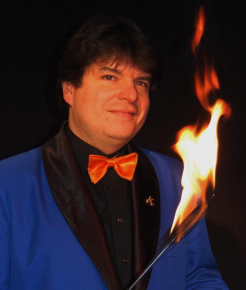 Magician Olivier OK MAGICS with flaming torch