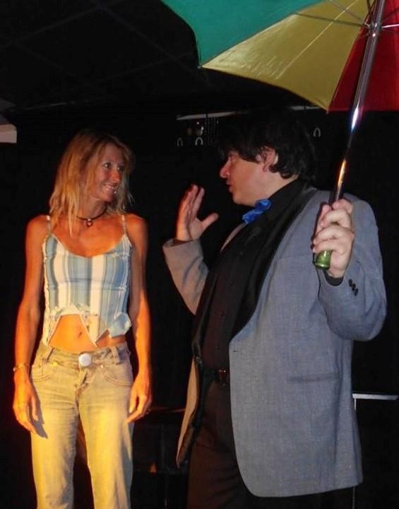 Magician Olivier Klinkenberg OK MAGICS interactive stage magic trick with spectator and umbrella in Tenerife Spain August 2015