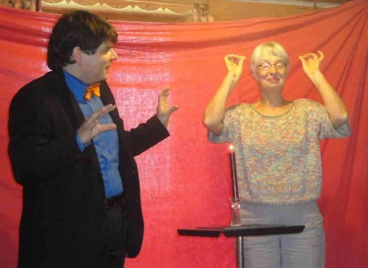Magician Olivier OK MAGICS interacting with magical spectator during close-up show in Bourgogne France 2010
